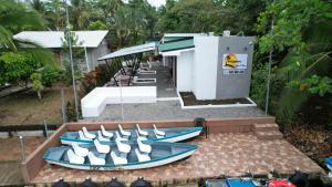 a group of boats sitting outside of a gas station at Tortuguero7 lake view in Tortuguero