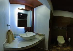 a bathroom with a sink and a toilet at Tortuguero7 lake view in Tortuguero