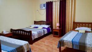 Voodi või voodid majutusasutuse TGH Guest House Badian toas +37 fotot