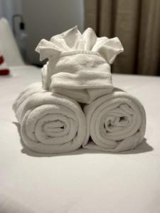 a pile of towels sitting on a table at Luxury Villa Home in Edmonton