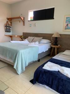 Cama o camas de una habitación en Casa de Praia Recanto do Sossego