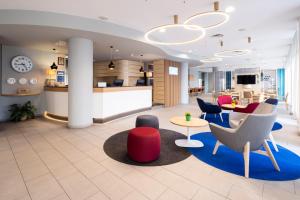 TV a/nebo společenská místnost v ubytování Holiday Inn Express Parma by IHG