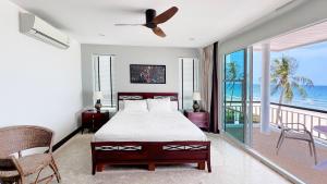 Ένα ή περισσότερα κρεβάτια σε δωμάτιο στο Absolute Beachfront villa +80 φωτογραφίες