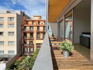 a balcony with a view of a building at Stay U-nique Apartments Pau Claris in Barcelona