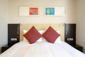 Postel nebo postele na pokoji v ubytování Hotel JAL City Kannai Yokohama