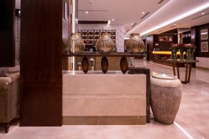 a lobby with vases on display in a store at فندق سمو ان - Sumo inn Hotel in Najran