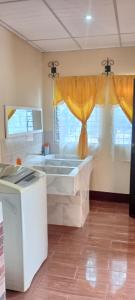 a large bathroom with a tub in a room at Casa Villa Flores in San Martín Zapotitlán