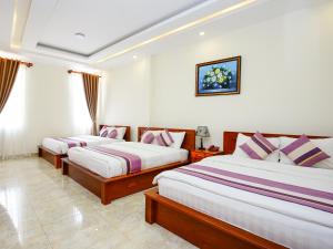 Voodi või voodid majutusasutuse Hoang Quan Hotel toas