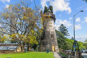 a lighthouse in the middle of a park at Urban Chic Brisbane Retreat in Brisbane