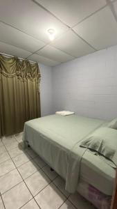 a bedroom with a bed in a room at Apartamento dos habitaciones in Mexicanos