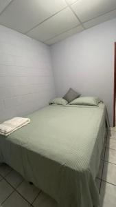 a bedroom with a large bed in a room at Apartamento dos habitaciones in Mexicanos