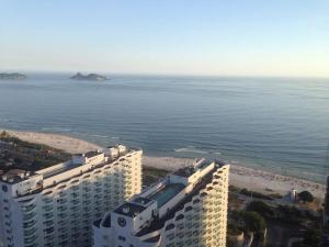 an aerial view of a building and the beach at Beachfront Condo Large Apartament in Rio de Janeiro