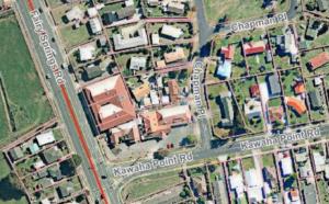 an overhead view of a city with houses and buildings at AWA Hotel in Rotorua