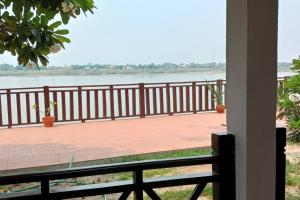 a balcony with a view of the river at MEKONG VIEW VILLE in Vientiane
