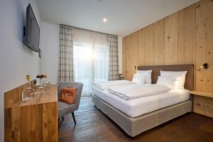Tempat tidur dalam kamar di Hotel Der Einrichter
