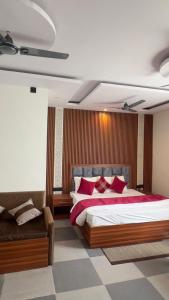 a bedroom with a large bed with red pillows at Sunny Pines Resort in Lansdowne