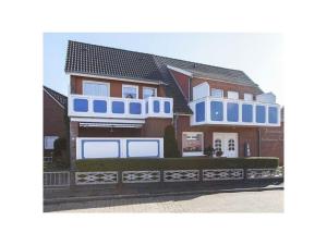 a rendering of a house with blue and white trim at Holiday home - Beckmann-Visser 3 in Borkum