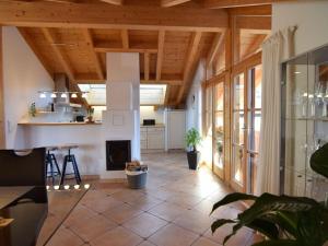 a large living room with a fireplace and wooden ceilings at Favorite place 2 in Garmisch-Partenkirchen