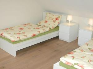 a bedroom with two beds and two night stands at Holiday home Altmühltal in Beilngries