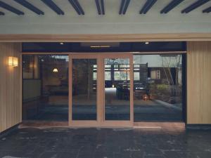 an entrance to a building with sliding glass doors at Hoeiso in Hakone