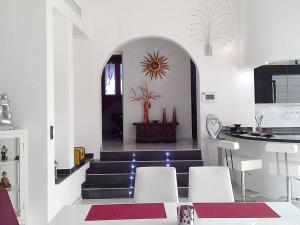 a room with stairs and a table and chairs at Holiday home with a roofed terrace in Morro del Jable