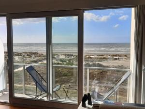 a window with a view of the ocean at Noordpas Comfortable holiday residence in Koksijde