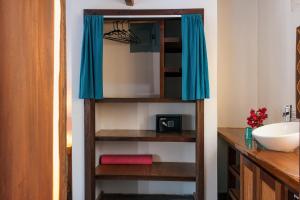 a closet in a bathroom with a basketball hoop at North Beach Retreat in San Pedro