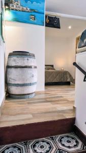 a room with a large barrel on the floor at Loft le dueffe al capo in Palermo