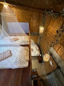 an overhead view of a bedroom with two beds at Elnora's Farm in Lucban