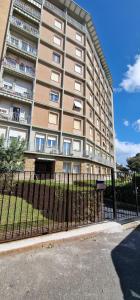 a tall building with a fence in front of it at KISSES FROM LIVORNO open space apartment - no pets allowed in Livorno