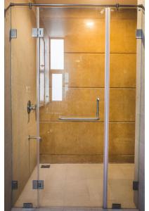 a shower stall with a glass door in a bathroom at Aspire villa 30 in Lonavala