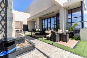 a house with a patio with furniture and windows at Westlands blue Condo with Pool&Gym in Nairobi