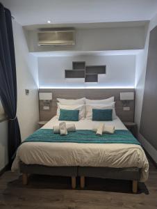 Postel nebo postele na pokoji v ubytování Les Palmiers