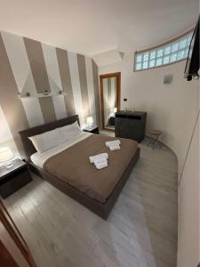 Postel nebo postele na pokoji v ubytování Cocciu d’amuri Apartment