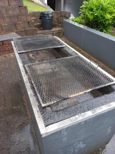 a metal grill on the ground in a yard at Seagull 310 in Margate