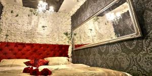 Postel nebo postele na pokoji v ubytování Ferrari wellness apartmán