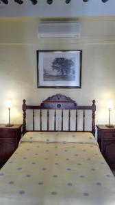 En eller flere senge i et værelse på Sierra Alcaide