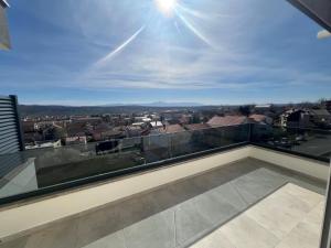 a balcony with a view of a city at Luxury Apartment Posusje in Posušje