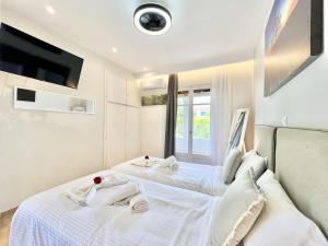 Katil atau katil-katil dalam bilik di Beachfront Suites GardenMare by DadoVillas