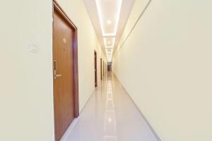 an empty corridor of a hospital with a hallway at FabHotel Mint Park in Hyderabad