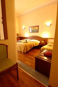 Postel nebo postele na pokoji v ubytování Hotel Palazzo Vecchio