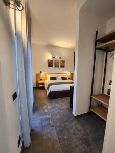 מיטה או מיטות בחדר ב-Agriturismo Il Vivaio