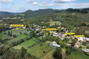 an aerial view of a park with houses and trees at Myrtle Tree Lodge Flowers, Kangaroo Valley in Kangaroo Valley