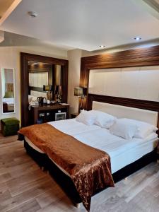 Voodi või voodid majutusasutuse Duna Garden Hotel toas