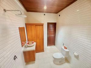 a bathroom with a toilet and a sink at Bupon House Jepun Room in Gianyar +10 photos