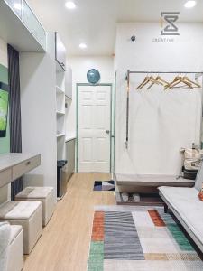a bathroom with a shower and a tub in a room at CreativeSpace-Mactan2 in Lapu Lapu City