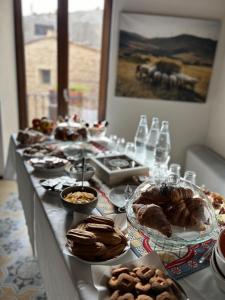 a long table with many different types of food on it at BAGLIO TRAMONTANA in Gangi