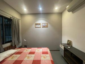 Ein Bett oder Betten in einem Zimmer der Unterkunft Le Fig Homes