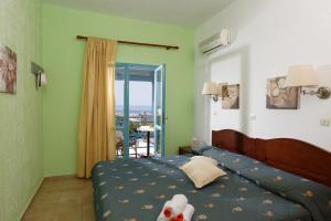 Ένα ή περισσότερα κρεβάτια σε δωμάτιο στο  Piskopiano Village 