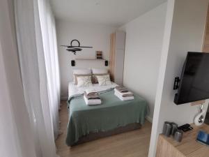 Postelja oz. postelje v sobi nastanitve Le Stoubenn, raffiné et chaleureux
